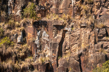 Rock climbing wall with rough texture on the side of a cliff face