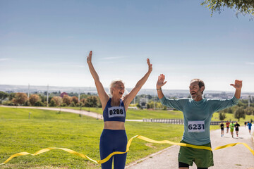 senior mature people marathon - race winners, senior couple running