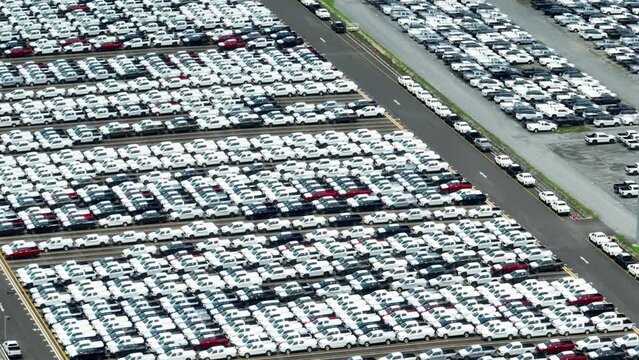 The drone could capture aerial footage of the entire parking lot, showcasing the number of vehicles being produced. This footage could be used to the automotive industry. import and export business
