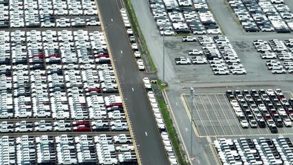 The drone could capture close-up shots of individual cars, showcasing their unique design and features. This footage could be used in promotional videos for car manufacturers. automotive industry
