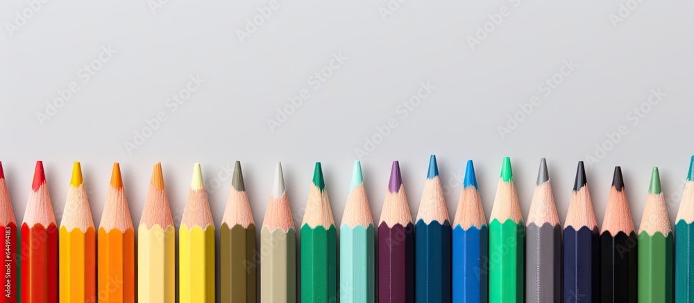 Poster close up image of colored pencils on a isolated pastel background copy space