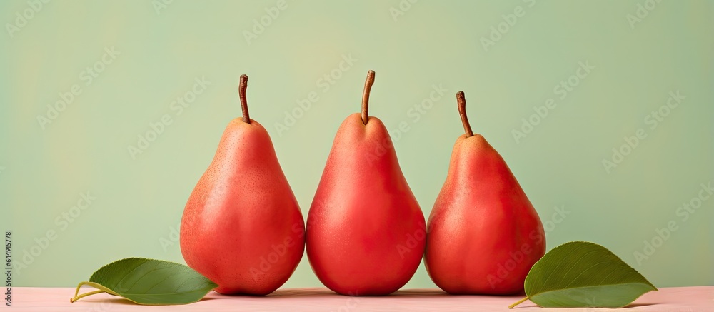 Poster red pears with leaves on a isolated pastel background copy space