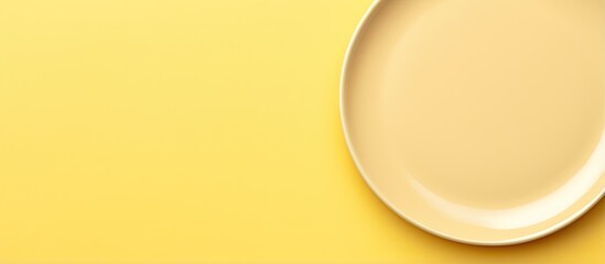 Yellow plate against isolated pastel background Copy space