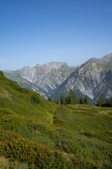 mountain landscape with view on alpine summits and blue sky	