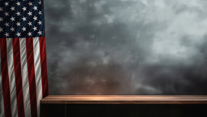 American flag hanging on the side of grey wall with table in front of wall. Background copy space.American flag hanging on the side of grey wall with table in front of wall.Background copy space.