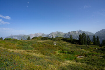 Fototapeta na wymiar mountain landscape with view on alpine summits and blue sky