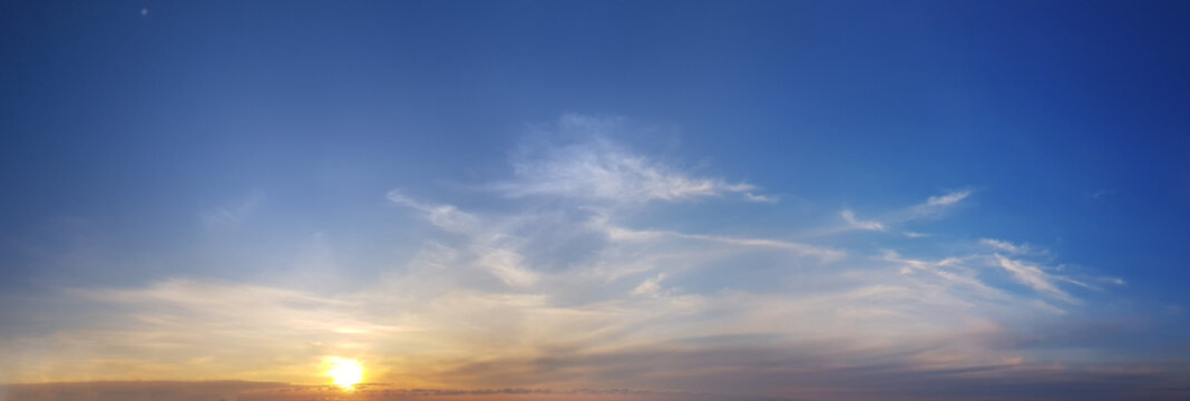 Orange sun and blue sky with cloud, dramatic sunny atmosphere wallpaper background