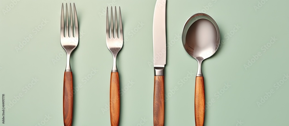 Poster arranged utensils on table isolated pastel background copy space