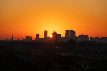 Naklejka premium Skyline The Hague with a beautiful red yellow sunrise 
