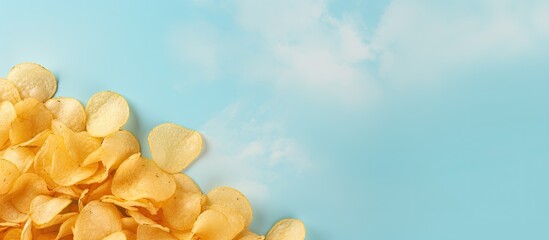 Crushed potato chips stacked on isolated pastel background Copy space
