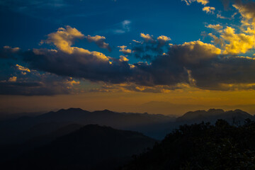 Fototapeta premium Peak of tropical forest mountain sunset sky with cloud nature landscape background