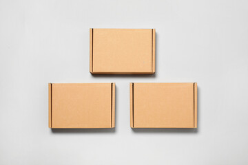 Cardboard boxes on white background, flat lay. Packaging goods