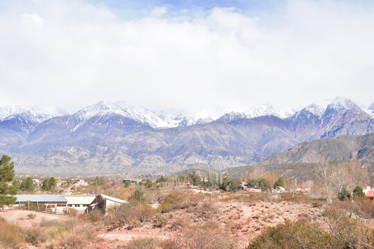 the andes mountain range in mendoza argentina with imposing mountains and snow-capped peaks.