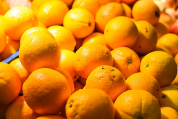 Many oranges in the night market of a street food in Malaysia