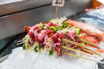 Many  raw snacks and seafood in Jalan Alor street food in Kuala Lumpur