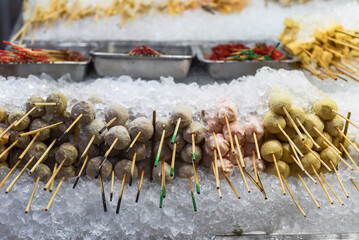 Many  raw snacks and seafood in Jalan Alor street food in Kuala Lumpur