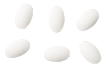 White pills isolated on white background, top view