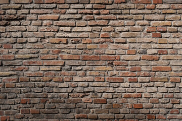 Old brown brick wall texture. Concrete background