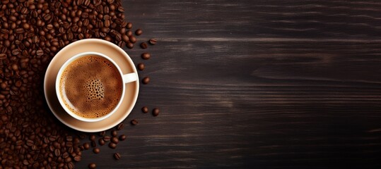 Cup of coffee and coffee beans on wooden background. Copy space, horizontal banner, top view