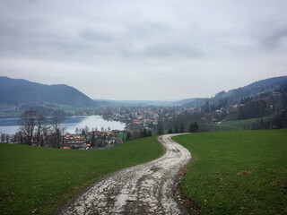 Mountain landscape with lake and road near Schliersee, Bavaria, Germany, April 2019
