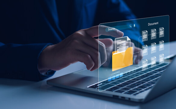 Document Management And Network System Concept. Businessman Use Smart Tablet Loading Documents In Online Archives ,Document Management Storage And Technology On Digital Document Paperless Operation.