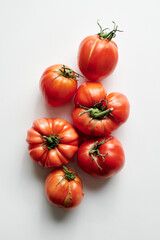 Red fresh tomatoes isolated on white background. Eco organic vegetables, seasonal harvest