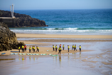 Young surfers train on Playa de Palombina Las Camaras in Celorio, Green coast of Asturias, North...