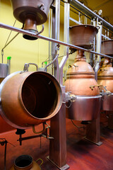 Gin distillation process in copper tanks in Spanish bodega