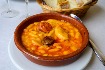 Fabada asturiana, Asturian bean stew, Spain, hot and heavy dish served with Asturian cider or a red wine, made with shoulder pork, pancetta or bacon, morcilla blood sausage, chorizo