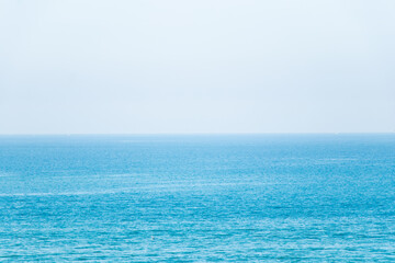 Blue color of sea with the clear sky background