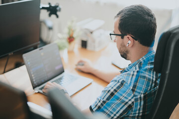 Portrait professional man programmer working concentrated on computer diverse offices. Modern IT technologies, development of artificial intelligence, programs, applications and video games concept