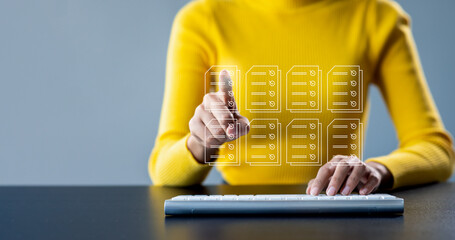 Document management concept with icons on virtual screen, ERP, Businesswoman working on keyboard...