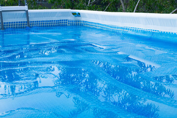 Swimming Pool with  solar film covers the pool.
Film for heating water and protection pollution. Pool care