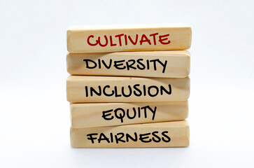 Cultivate diversity, inclusion, equity and fairness text on wooden blocks