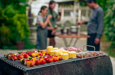 BBQ Fun Party with Grandparents, Family Gathering in the Garden, Summertime with grandpa, grandma, father and mother, BBQ Grill