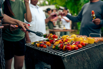 BBQ Fun Party with Grandparents, Family Gathering in the Garden, Summertime with grandpa, grandma, father and mother, BBQ Grill