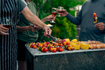 BBQ Fun Party with Grandparents, Family Gathering in the Garden, Summertime with grandpa, grandma, father and mother, BBQ Grill