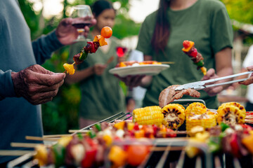 BBQ Fun Party with Grandparents, Family Gathering in the Garden, Summertime with grandpa, grandma,...