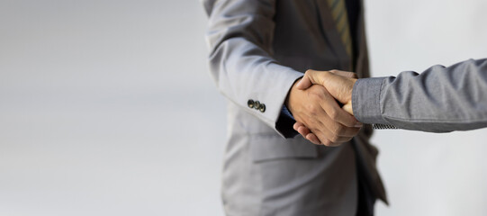 Handshake, business people reach out to shake hands.