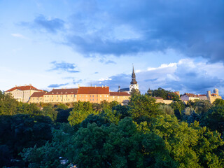 famous historic old Tallinn city wall in sunset with castle
