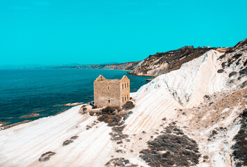 Punta Bianca, abandoned stone house on white cliffs in Sicily, Agrigento.