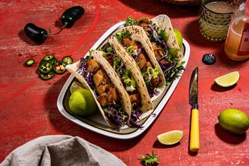 Tacos with roasted chiken with cabbage, salad, feta cheese and sauce