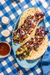 Tacos with roasted chiken with cabbage, salad, feta cheese and sauce - 644978542