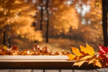 Empty wooden table top podium decorated with dry autumn leaves, blurred background of autumn plants