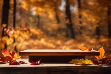 Empty wooden tabletop podium decorated with dry autumn leaves, blurred background of autumn plants 