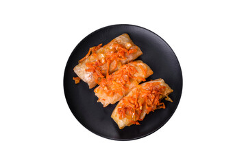 Cabbage rolls stuffed with ground beef and rice in tomato sauce