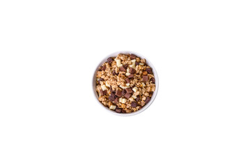 Tasty healthy breakfast with cereals, granola, chocolate, milk and jam on a dark concrete background