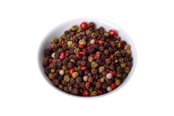 Pepper spice with peas of three different colors in a white saucer