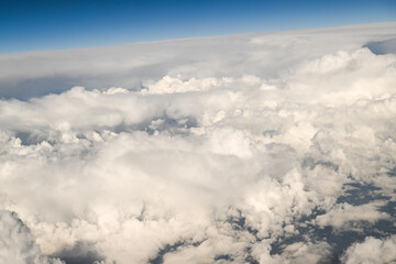 Fototapeta premium Beautiful Fluffy White and Gray Cumulonimbus Clouds on Blue Sky