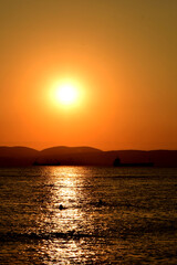 Inspirational tropical beach seascape. Orange and golden sunset sky, calmness, relaxing sunlight, summer mood. Vacation travel banner